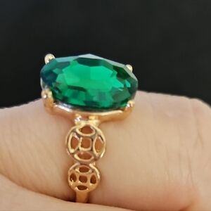 Elegant Gold Ring with Green Gemstone